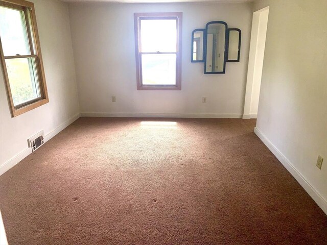 52 Burnett St, Granby, MA 01033 - carpeted empty room featuring healthy amount of natural light and baseboards