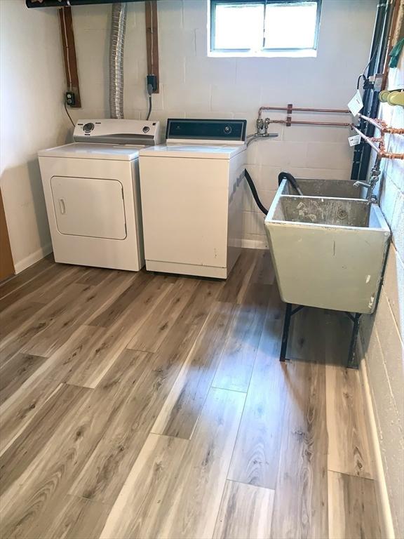 52 Burnett St, Granby, MA 01033 - laundry area featuring washer and dryer and wood finished floors