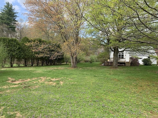 52 Burnett St, Granby, MA 01033 - view of green lawn featuring a deck