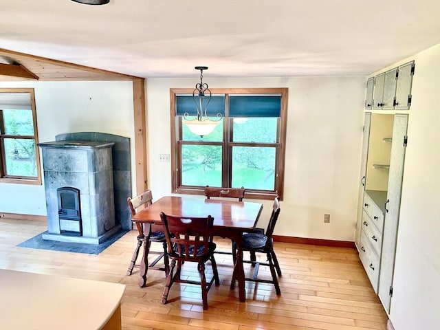 52 Burnett St, Granby, MA 01033 - dining area featuring light wood-style flooring, baseboards, and a tiled fireplace