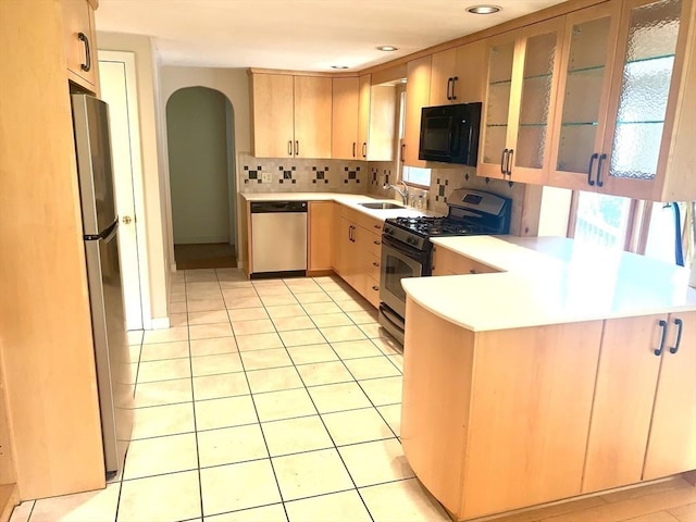 52 Burnett St, Granby, MA 01033 - kitchen with stainless steel appliances, arched walkways, a peninsula, plenty of natural light, and recessed lighting