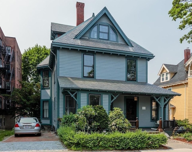 140 Highland Ave Unit 1, Somerville, MA 02143 - view of front of property with covered porch and a chimney