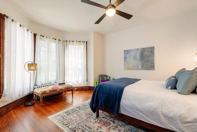 140 Highland Ave Unit 1, Somerville, MA 02143 - bedroom featuring wood finished floors, a ceiling fan, and baseboards