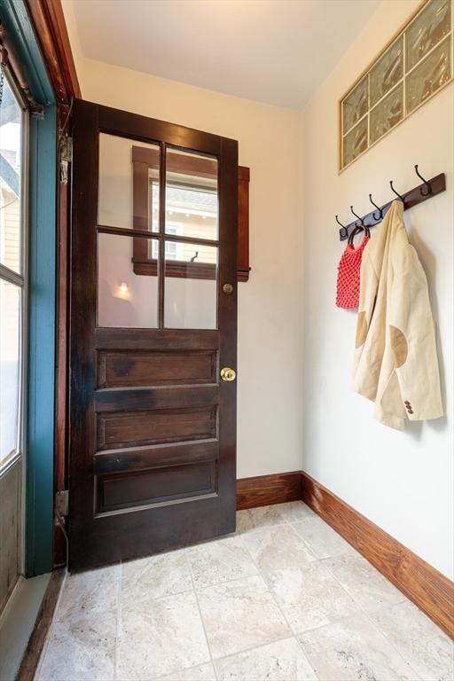 140 Highland Ave Unit 1, Somerville, MA 02143 - doorway with plenty of natural light and baseboards