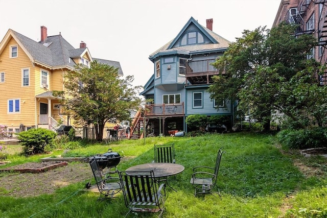 140 Highland Ave Unit 1, Somerville, MA 02143 - view of green lawn with stairway and a wooden deck