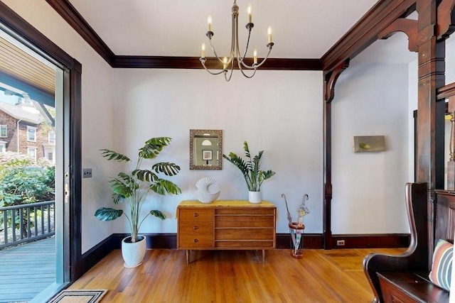 140 Highland Ave Unit 1, Somerville, MA 02143 - sitting room featuring wood finished floors, crown molding, a chandelier, and baseboards