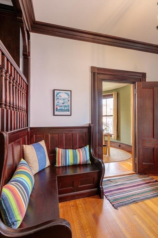 140 Highland Ave Unit 1, Somerville, MA 02143 - living area with crown molding and wood finished floors