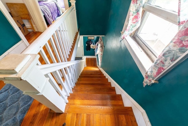 stairway with wood finished floors