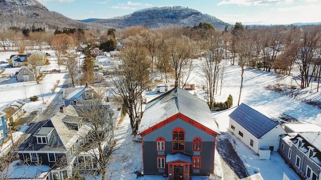 snowy aerial view with a mountain view