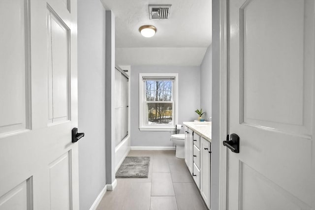 bathroom with tile patterned floors, visible vents, toilet, baseboards, and vanity