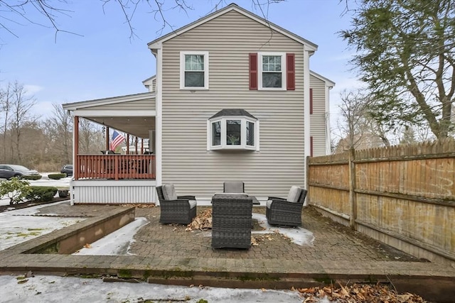 back of house featuring a patio and fence