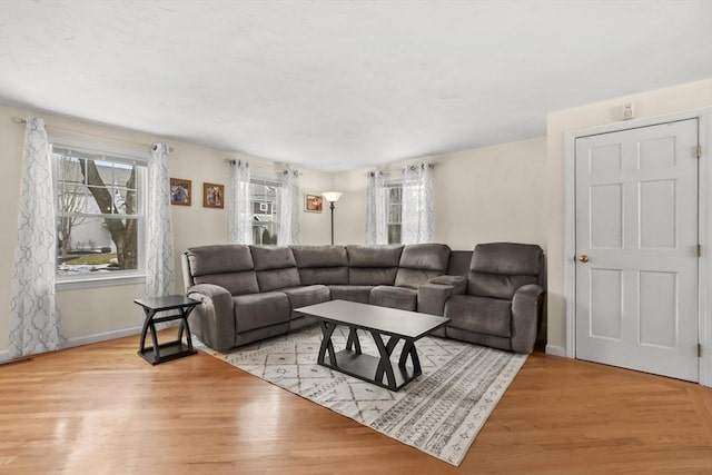 living room with wood finished floors and baseboards