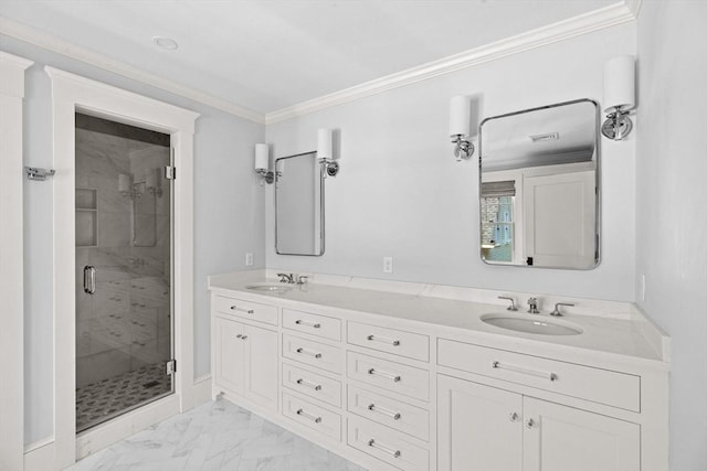 bathroom featuring crown molding, a shower stall, a sink, and marble finish floor