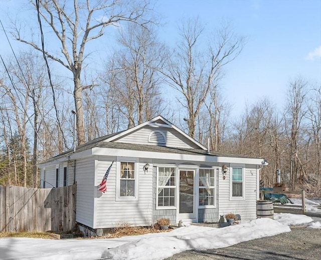 view of front of home featuring fence