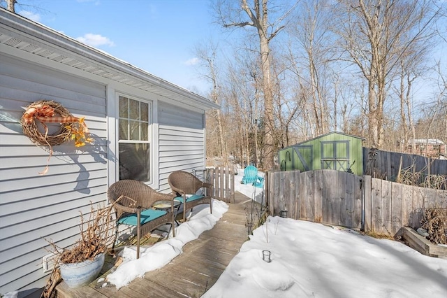 view of patio / terrace featuring fence, an outdoor structure, and a shed