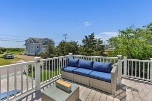 wooden deck featuring outdoor lounge area