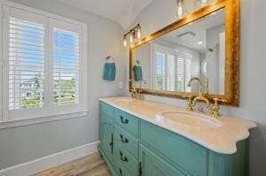 bathroom featuring hardwood / wood-style floors and vanity