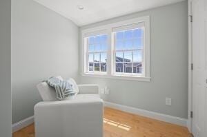 sitting room with hardwood / wood-style flooring