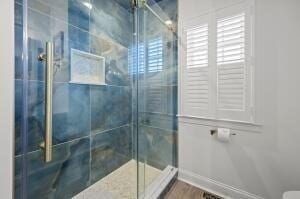 bathroom featuring an enclosed shower