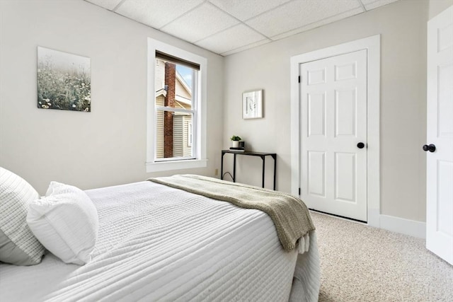 162 Park St Unit 1, Beverly, MA 01915 - carpeted bedroom with a paneled ceiling and baseboards