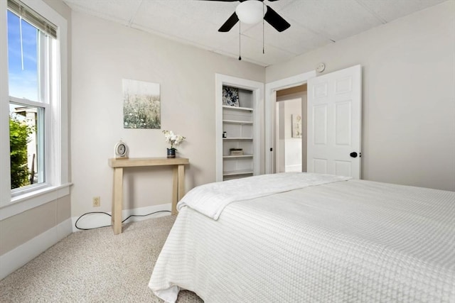 162 Park St Unit 1, Beverly, MA 01915 - carpeted bedroom with multiple windows and a ceiling fan