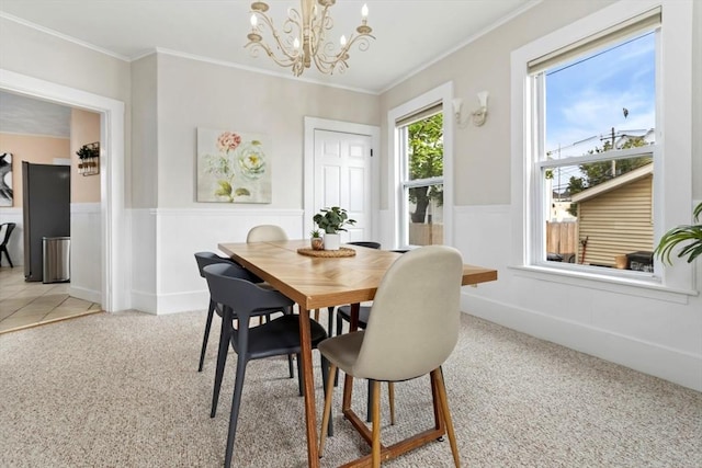 162 Park St Unit 1, Beverly, MA 01915 - dining room featuring light colored carpet, a chandelier, ornamental molding, and wainscoting