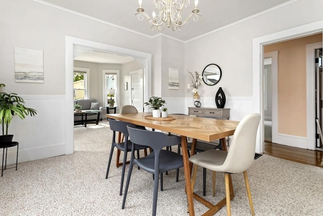 162 Park St Unit 1, Beverly, MA 01915 - dining area with a chandelier, wainscoting, ornamental molding, and carpet flooring