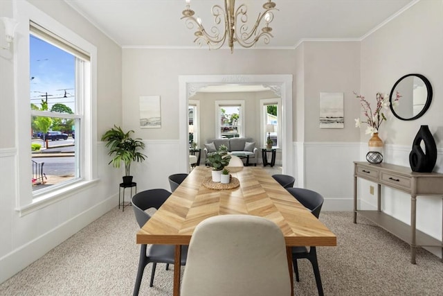 162 Park St Unit 1, Beverly, MA 01915 - carpeted dining area featuring a wainscoted wall, a chandelier, and crown molding