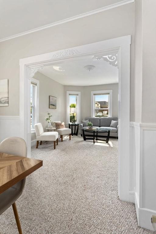 162 Park St Unit 1, Beverly, MA 01915 - carpeted living room with wainscoting and ornamental molding