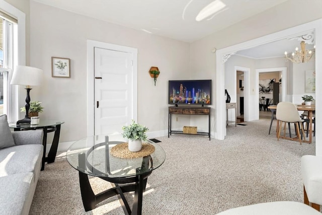 162 Park St Unit 1, Beverly, MA 01915 - living area with a chandelier, carpet, and baseboards