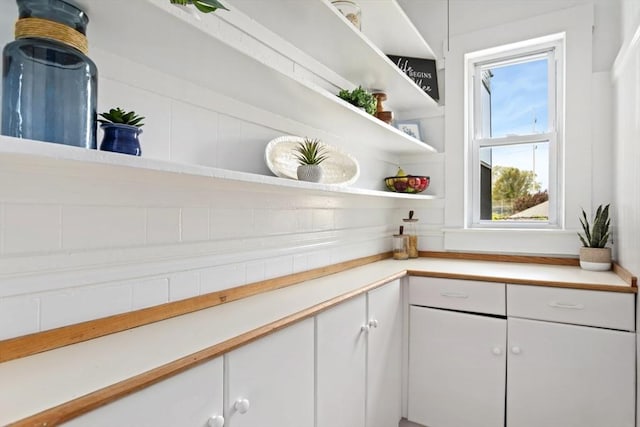 162 Park St Unit 1, Beverly, MA 01915 - kitchen with open shelves, white cabinetry, and light countertops