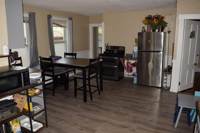 1407-1409 Worcester St, Springfield, MA 01151 - dining area featuring dark wood-style floors and a textured ceiling