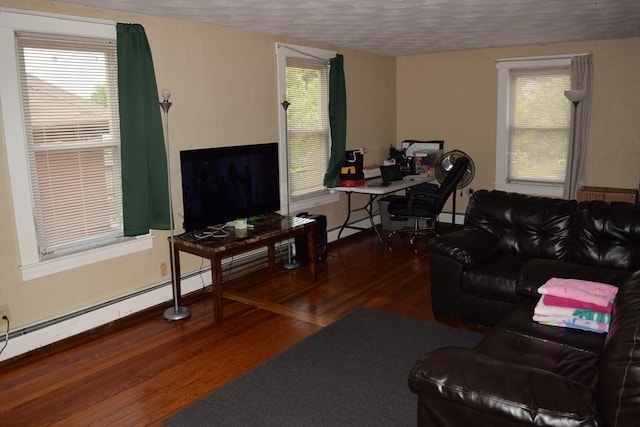 1407-1409 Worcester St, Springfield, MA 01151 - living room with wood finished floors, healthy amount of natural light, a baseboard radiator, a desk, and a textured ceiling