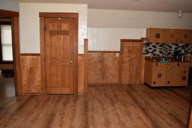 1407-1409 Worcester St, Springfield, MA 01151 - kitchen featuring wainscoting, wood finished floors, a sink, decorative backsplash, and wood walls