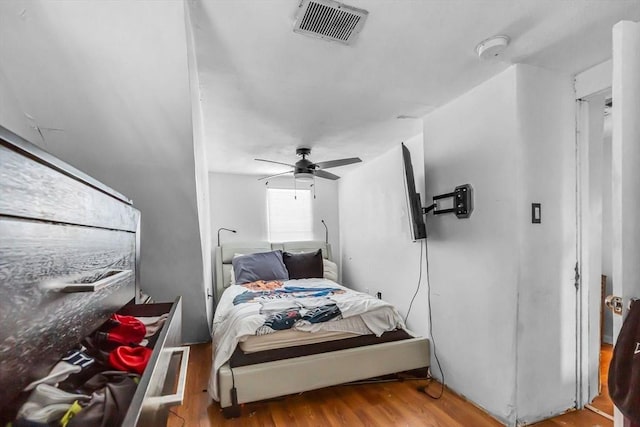 bedroom with ceiling fan and light hardwood / wood-style flooring