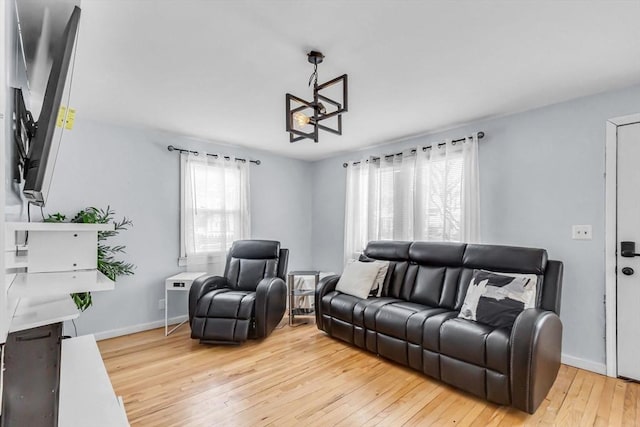 living room with light hardwood / wood-style flooring