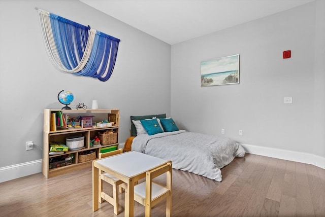 8 Sanborn St Unit 2012, Reading, MA 01867 - bedroom with light wood finished floors and baseboards