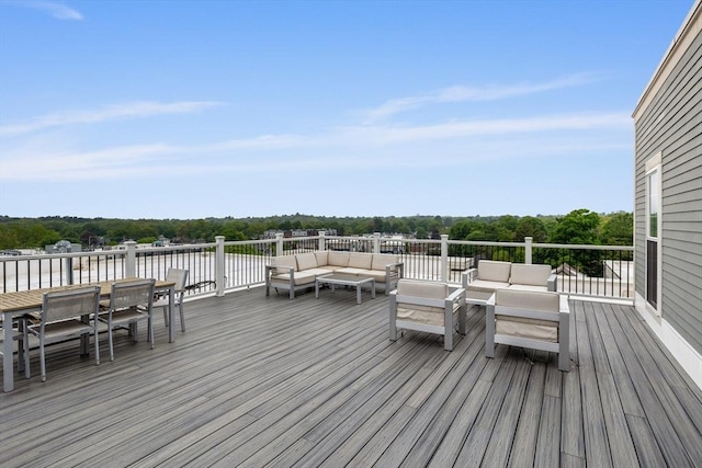 8 Sanborn St Unit 2012, Reading, MA 01867 - wooden deck with an outdoor living space, outdoor dining area, a water view, and view of wooded area