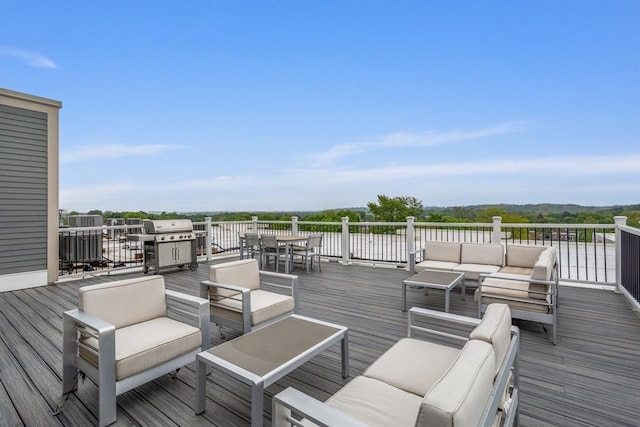 8 Sanborn St Unit 2012, Reading, MA 01867 - deck with outdoor lounge area, area for grilling, and outdoor dining space