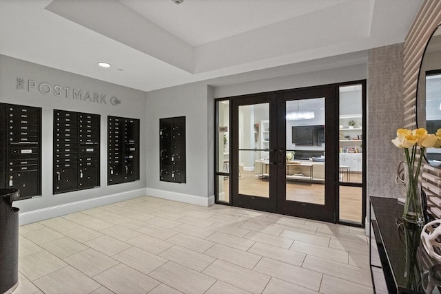 8 Sanborn St Unit 2012, Reading, MA 01867 - interior space with french doors, mail area, a raised ceiling, baseboards, and recessed lighting