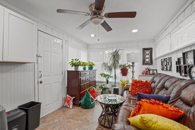 living area featuring a ceiling fan and recessed lighting