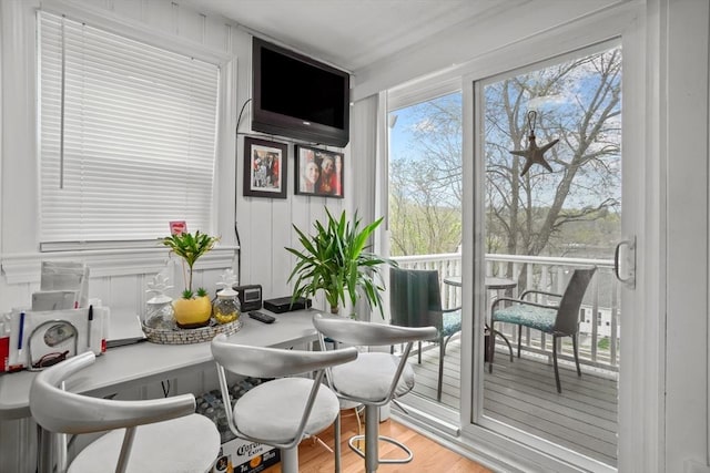 dining space with wood finished floors