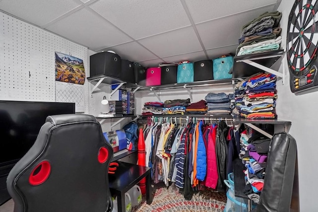 walk in closet with a paneled ceiling