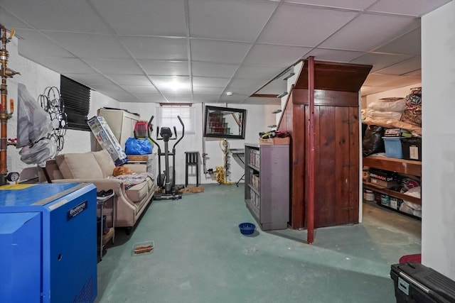 basement featuring a paneled ceiling