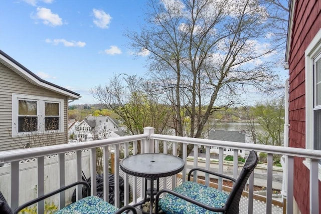 balcony featuring a water view