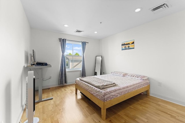 318 Rindge Ave Unit 411, Cambridge, MA 02140 - bedroom with light wood-style flooring and recessed lighting