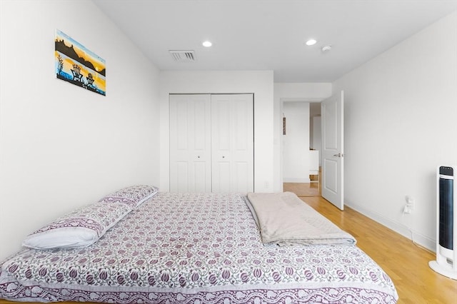 318 Rindge Ave Unit 411, Cambridge, MA 02140 - bedroom featuring light wood finished floors, recessed lighting, and a closet