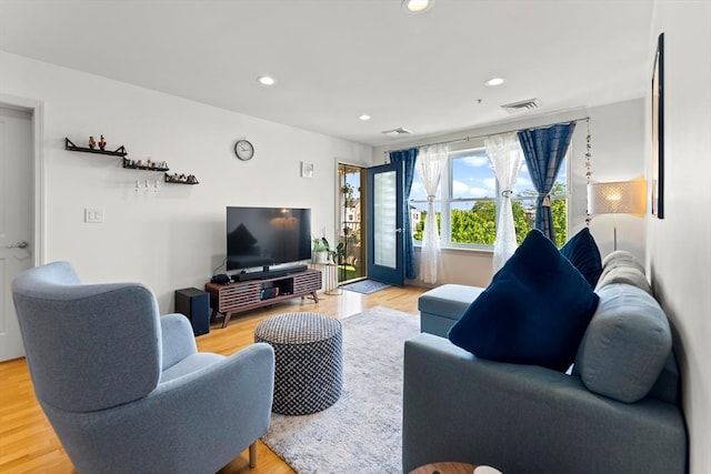 318 Rindge Ave Unit 411, Cambridge, MA 02140 - living room with light wood-style flooring and recessed lighting