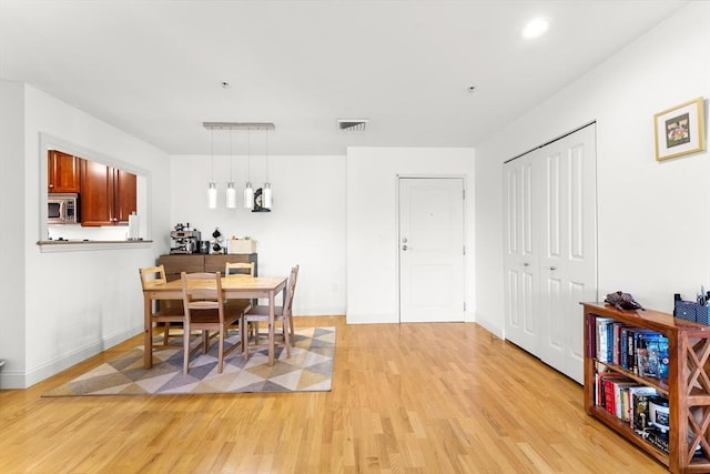 318 Rindge Ave Unit 411, Cambridge, MA 02140 - dining space with light wood-type flooring and recessed lighting