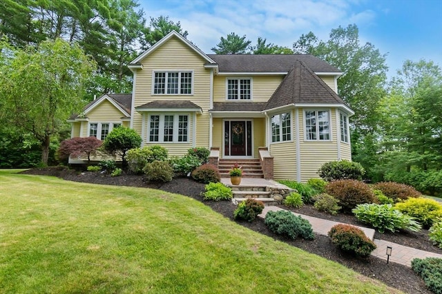 15 Hillside St, Rowley, MA 01969 - view of front of property featuring a front yard and a shingled roof